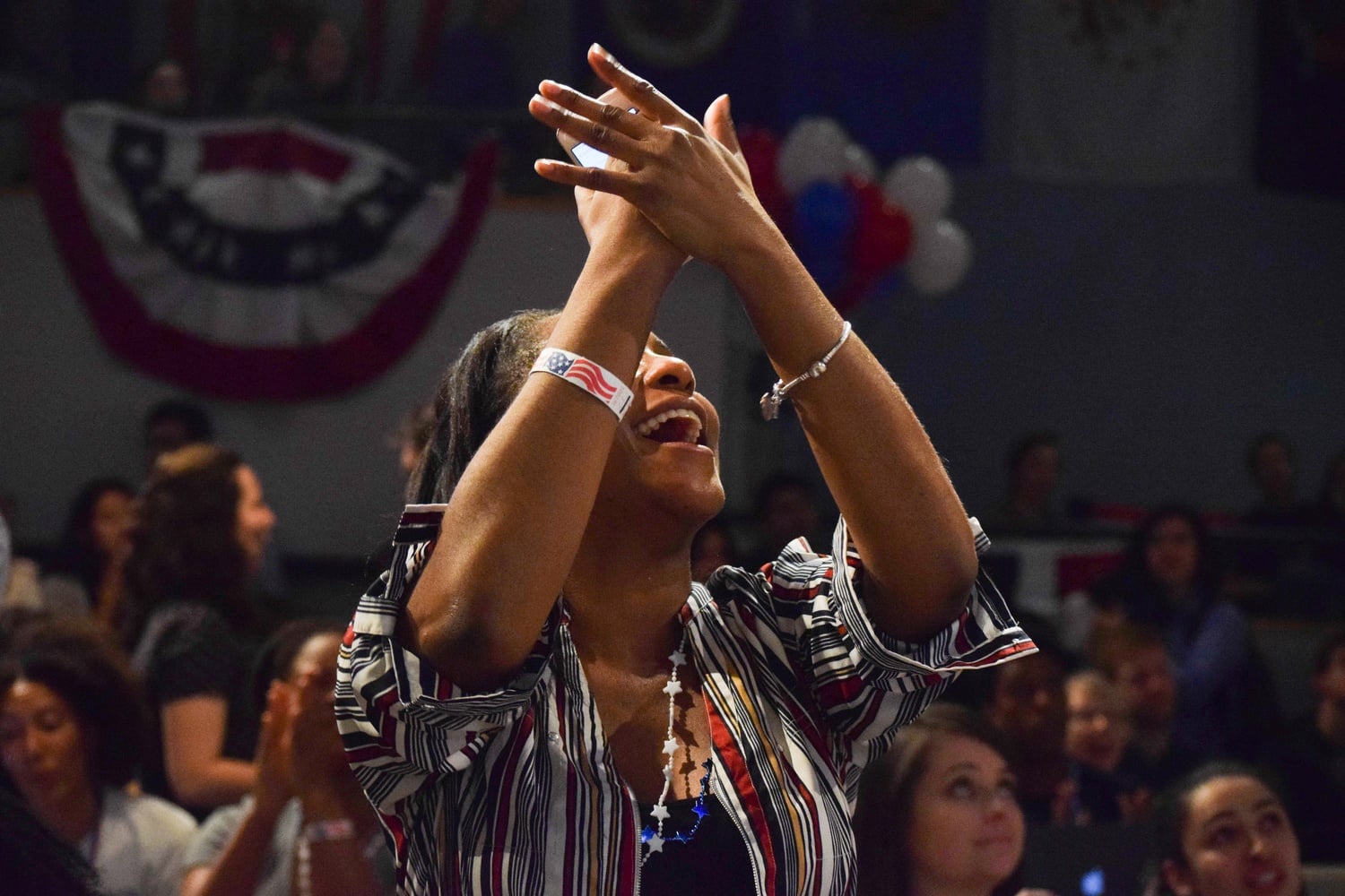 Sade A. Abraham, a Graduate School of Education alum, cheers upon hearing CNN report that Texas U.S. Senate candidate Beto O’Rourke was pulling ahead. O'Rourke ultimately lost to incumbent Ted Cruz.