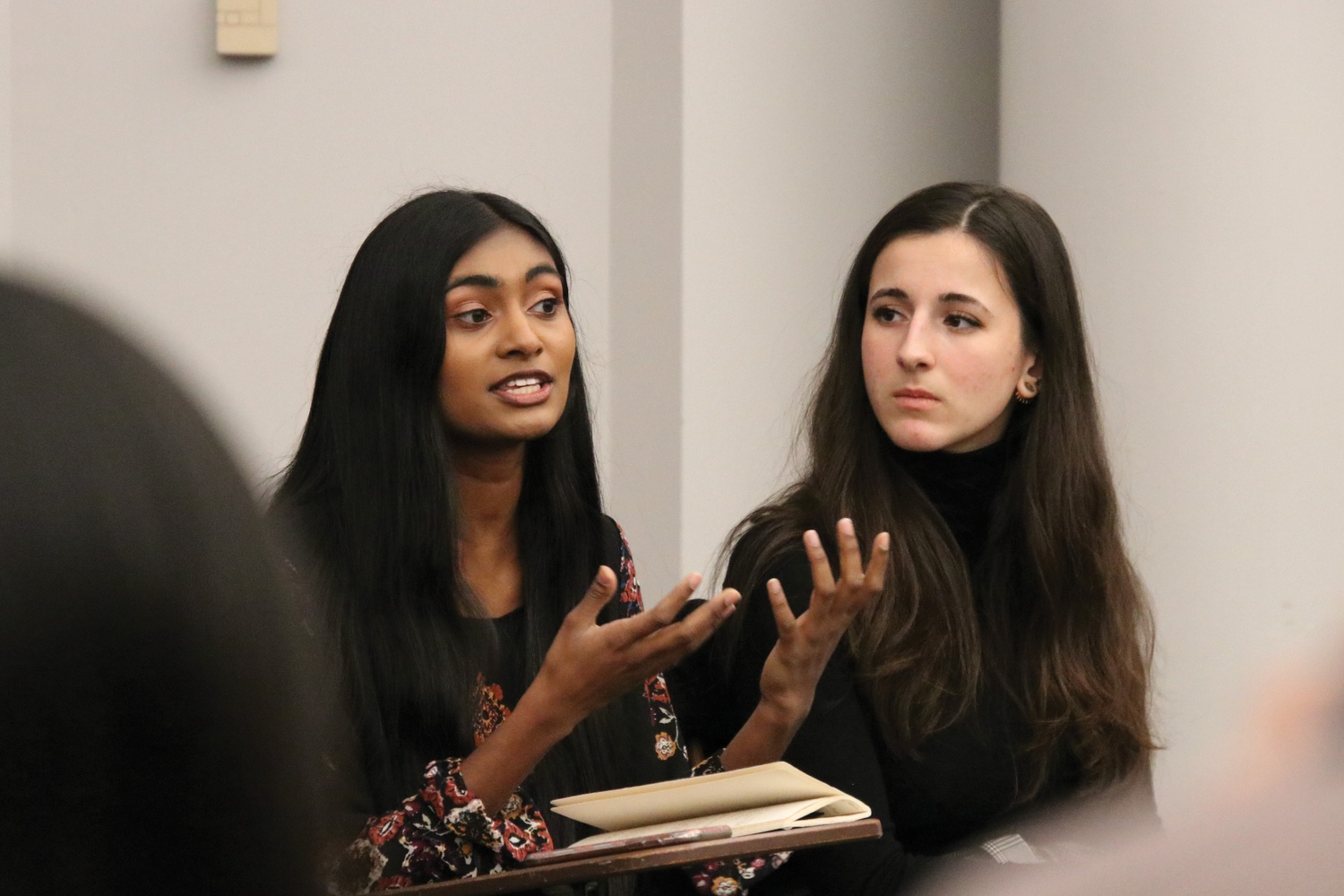 Sruthi Palaniappan '20 and Julia M. Huesa ’20 at the UC-Crimson Crossfire Debate.