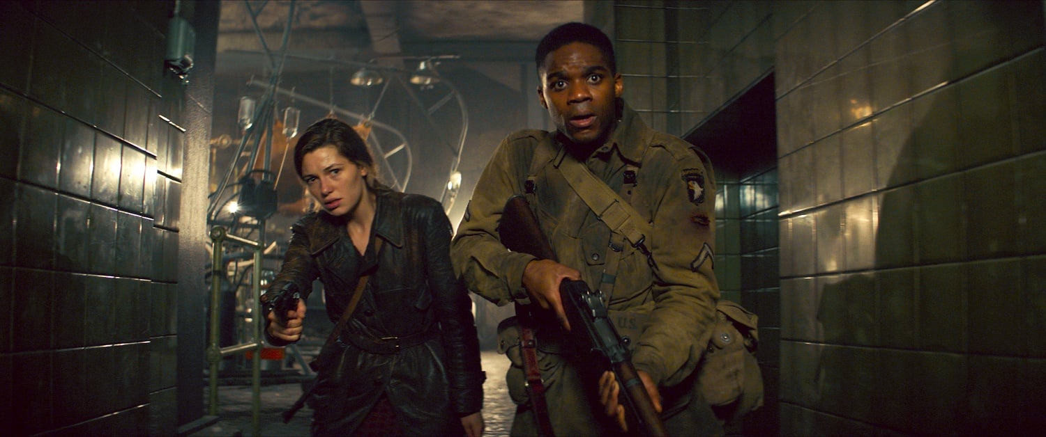 Mathilde Ollivier plays Chloe and Jovan Adepo plays Boyce in "Overlord" (2018).