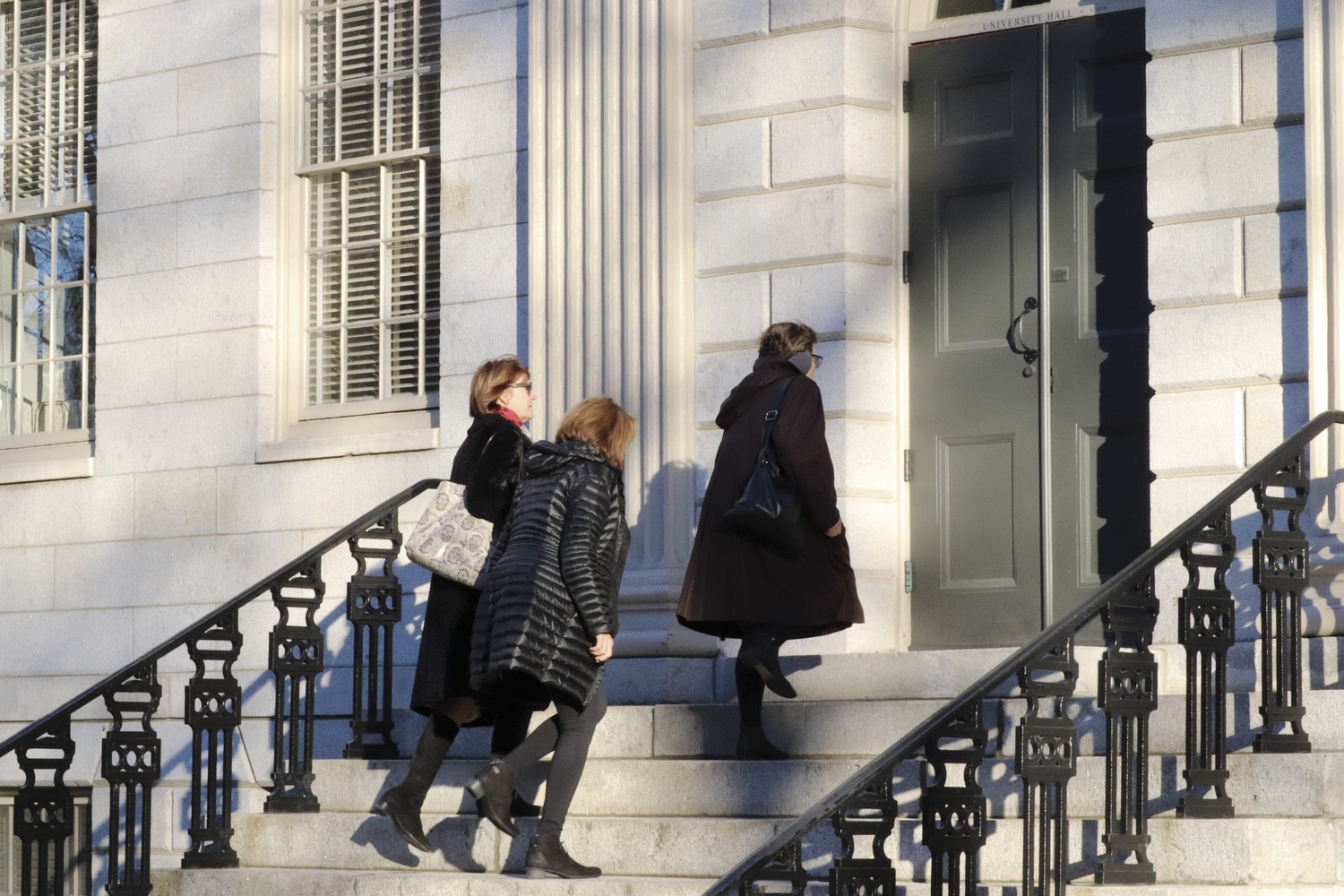 Faculty members enter University Hall for the December 2018 Faculty meeting.