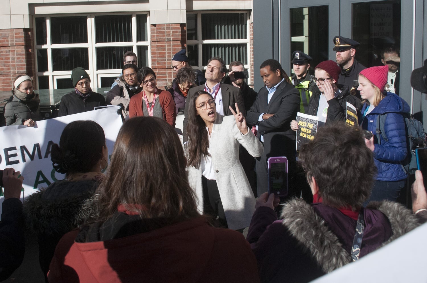 Alexandria Ocasio-Cortez joins a rally during Harvard's Bipartisan Program for Newly Elected Members of Congress to call attention to climate change and environmental justice.