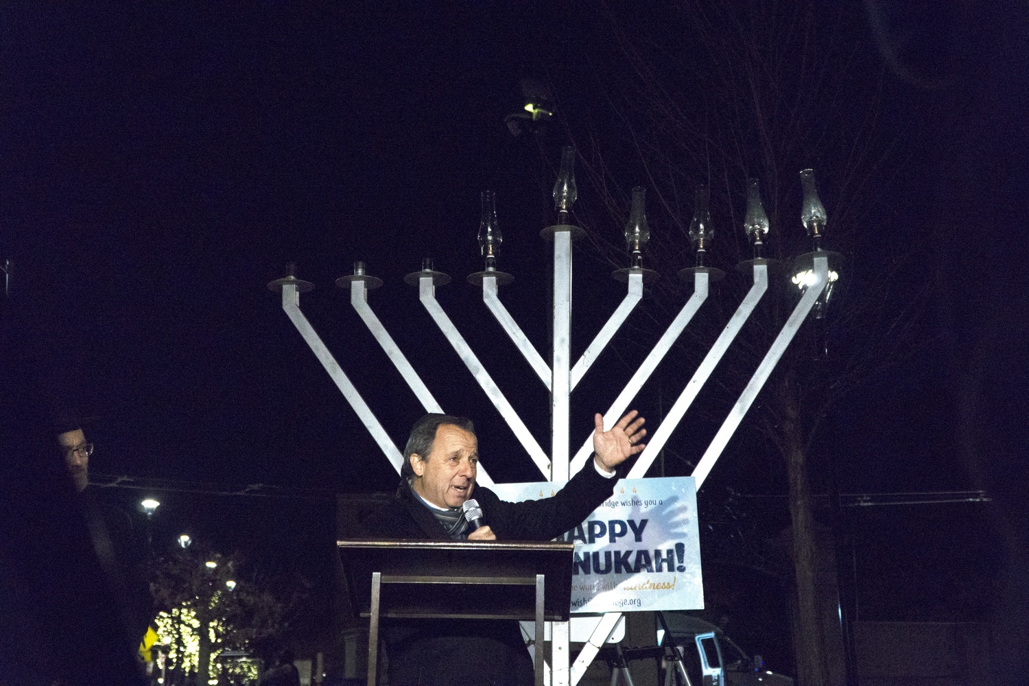 Pulitzer Prize-winning journalist Ron S. Suskind helped right the menorah after its toppling.