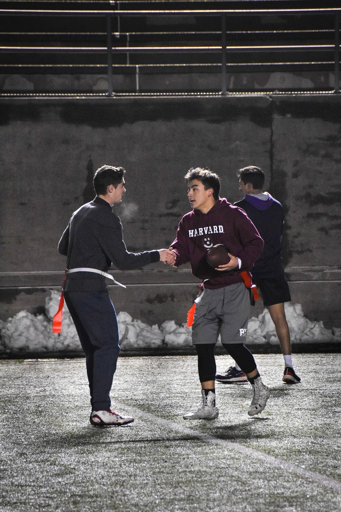 After scoring their final touchdown, teammates Jackson R. Hartje ‘20 and Raymond Hunt ‘21 shake hands as they congratulate each other on their victory against Yale, ultimately leading to a final score of 48-22.