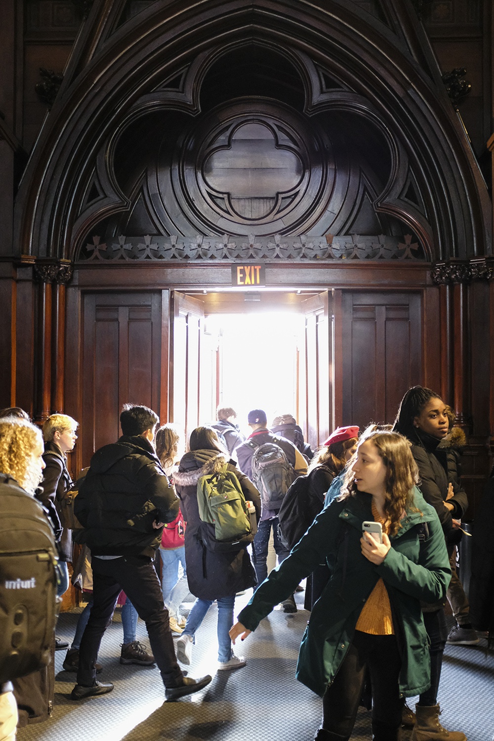 Students file out of Sanders Theater on the first day of Spring classes.