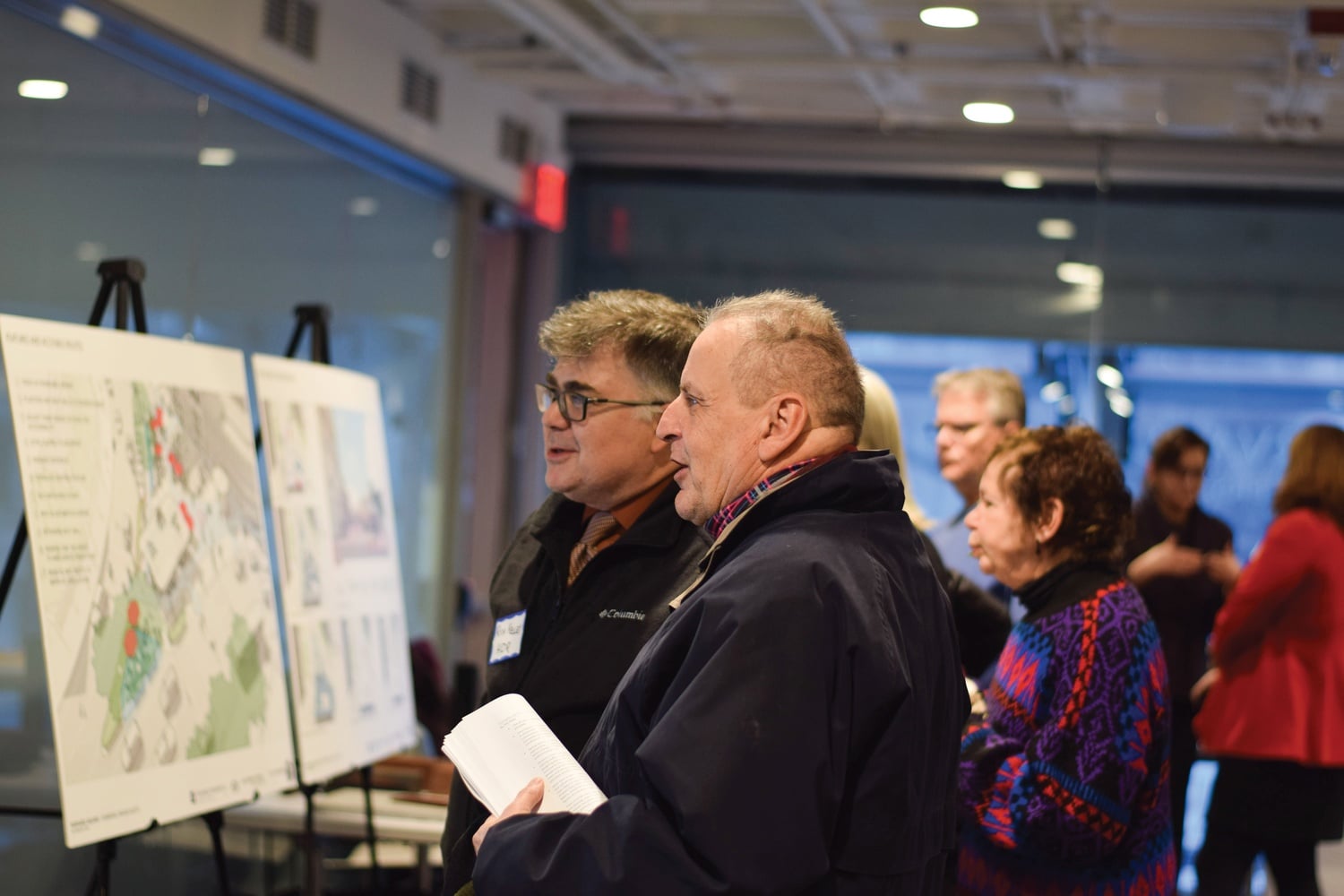 Cambridge residents gathered in the Smith Campus Center Thursday to view preliminary sketches of a redesigned Harvard Square Kiosk. The kiosk has housed a newsstand since 1984.