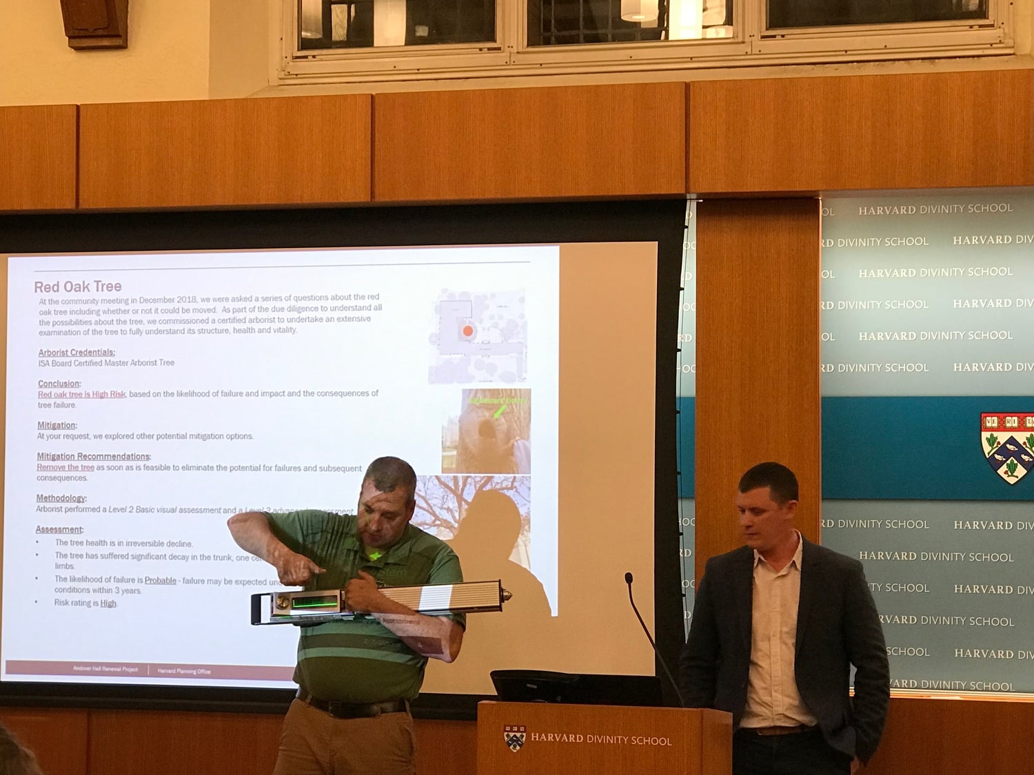 Timothy Armstrong, an arborist, gives a demonstration of the equipment used to evaluate a tree on Harvard Divinity School's grounds.
