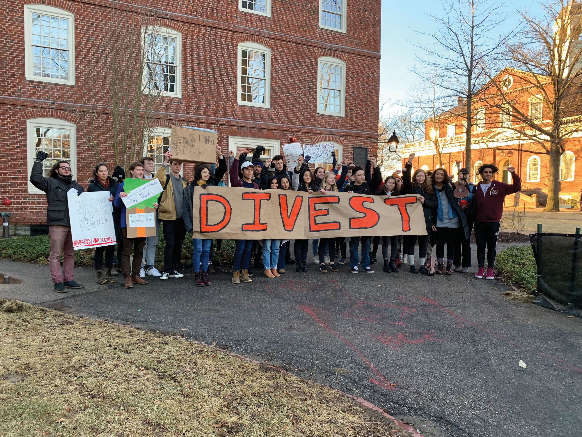 A group of University affiliates marched from Harvard Square to the Yard Friday pushing for administrators to consider divesting from fossil fuels.