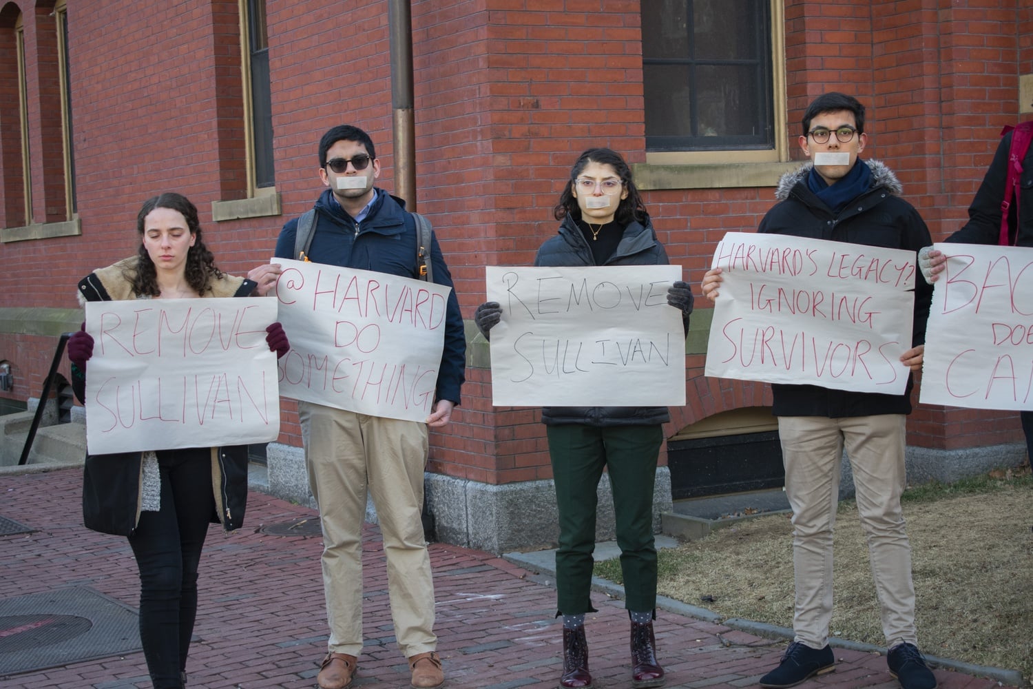 With tape over their mouths in recognition of the #MeToo movement, students demand action from the college following Ron Sullivan's decision to defend Harvey Weinstein.