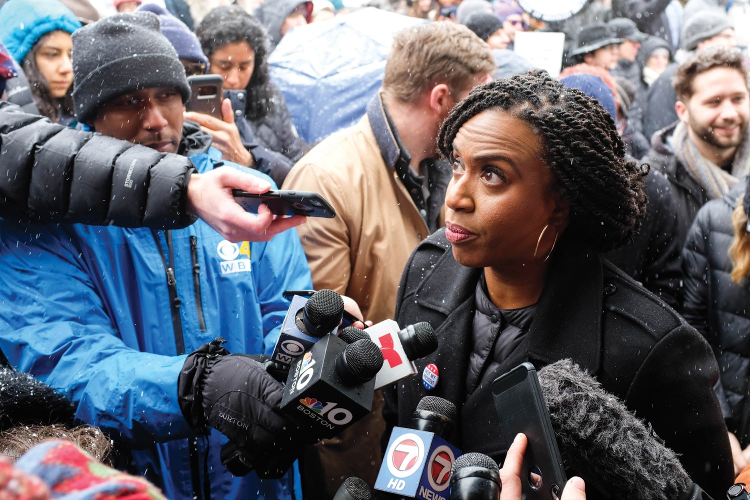 U.S. Representative Ayanna Pressley (D-Mass.) decries President Donald Trump's declaration of a national emergency to build a southern border wall at a protest Monday in Harvard Square.