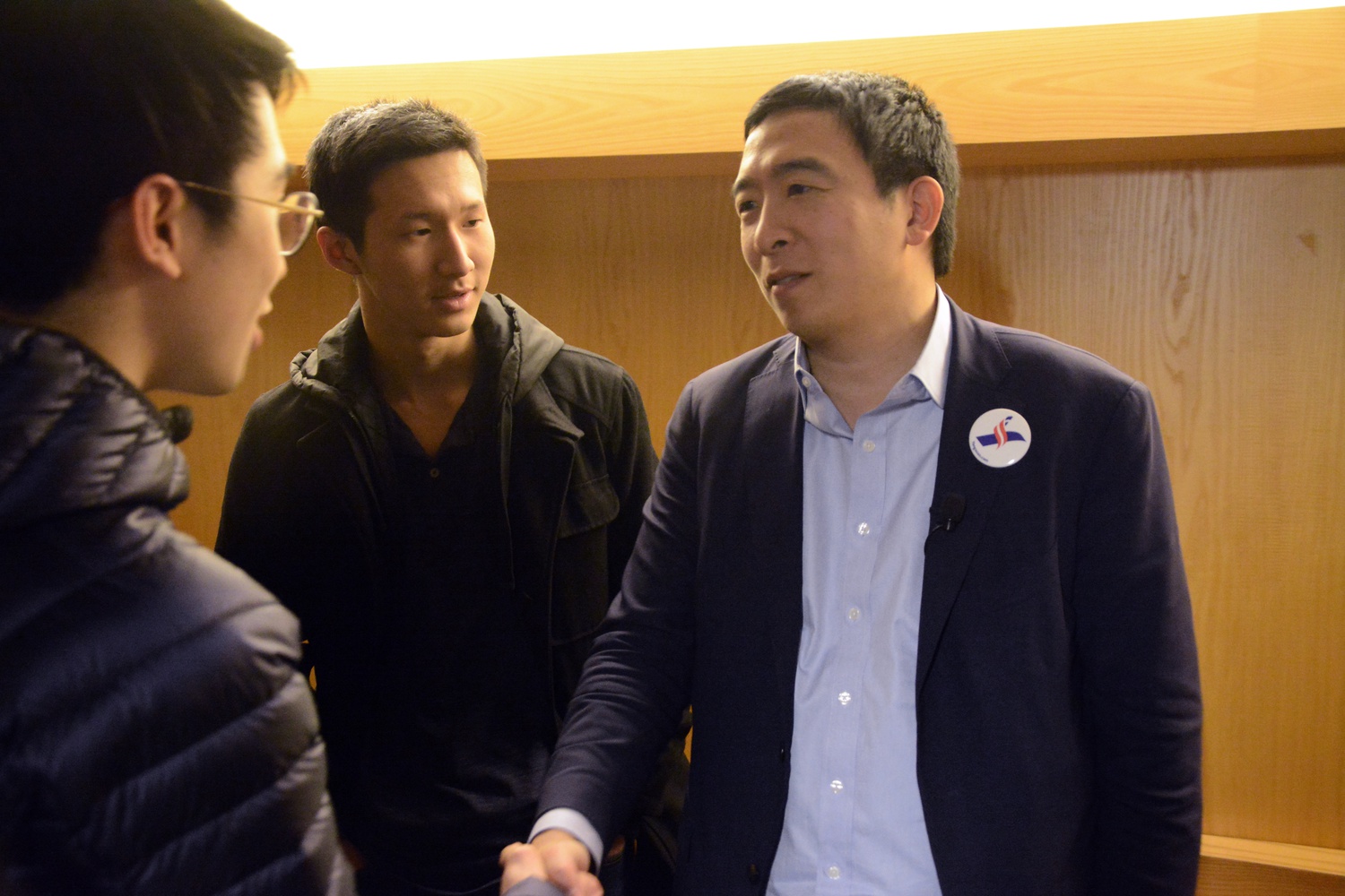 Andrew Yang interacts with Andrew Wang '22 and Ran Bi '22 after the event in Fong Auditorium