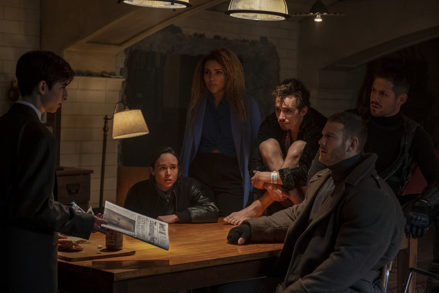 Aidan Gallagher, Ellen Page, Emmy Raver-Lampman, Robert Sheehan, Tom Hopper, and David Castaneda all star as former superheroes in “The Umbrella Academy.”