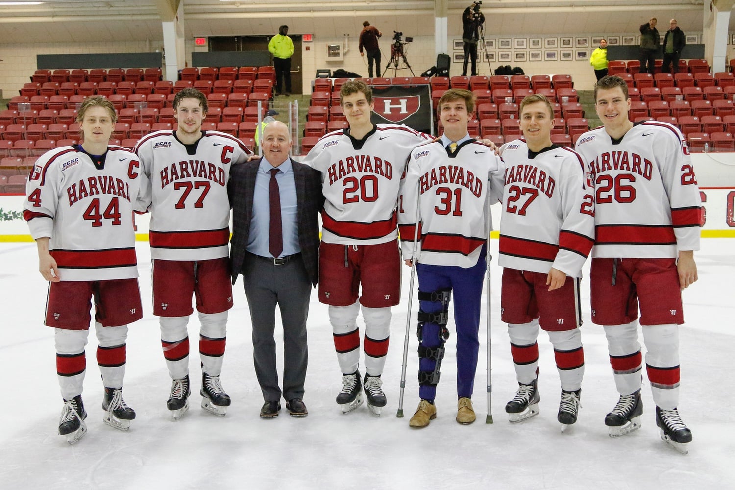 Lackey, pictured in a knee brace and using crutches, was unable to play in last weekend's senior night affair due to his right knee injury.