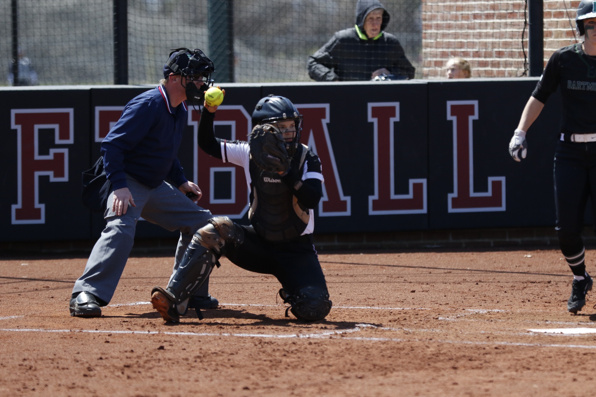 Junior catcher Lindey Knieb tosses the ball back to the pitcher against Dartmouth last April.