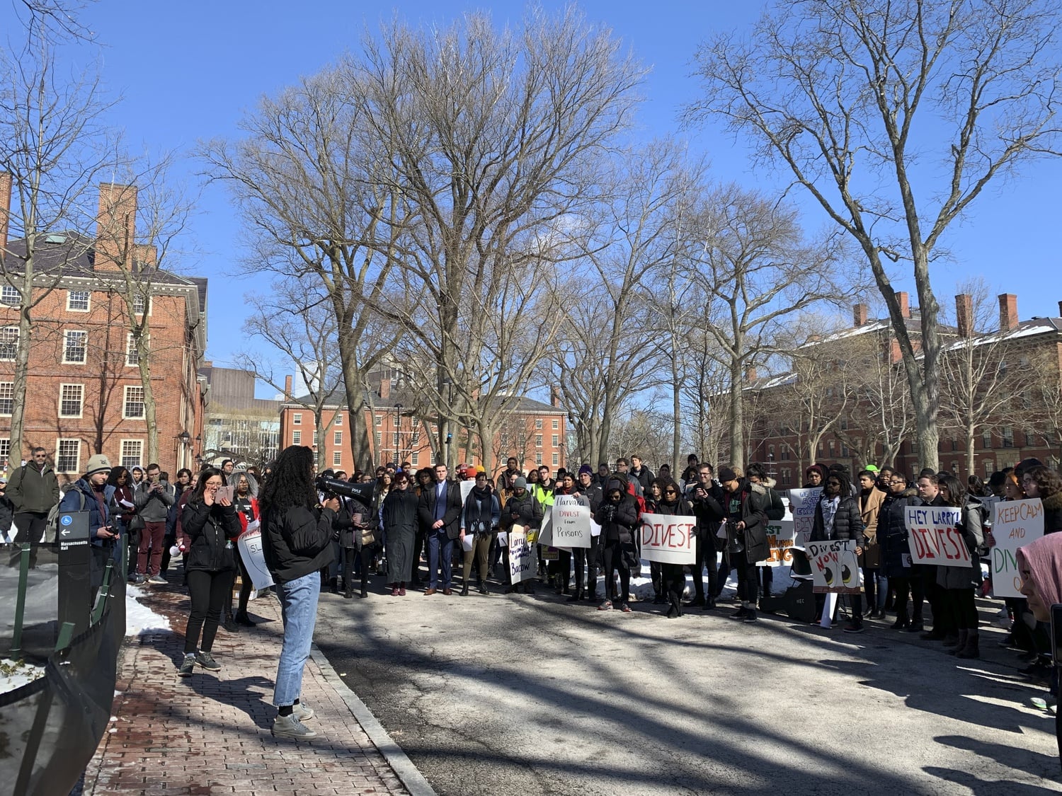 A group of Harvard affiliates rallied Friday to call on University President Lawrence S. Bacow to divest from the prison industry.