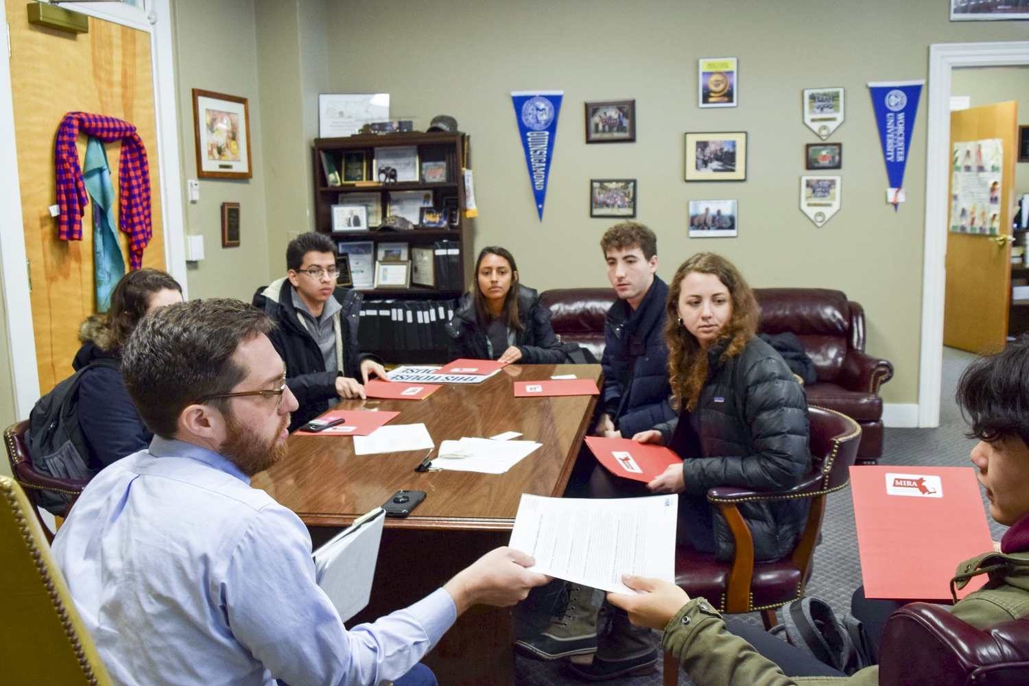 Harvard students visit state legislators at the State House on Monday to lobby for a new Safe Communities Act.
