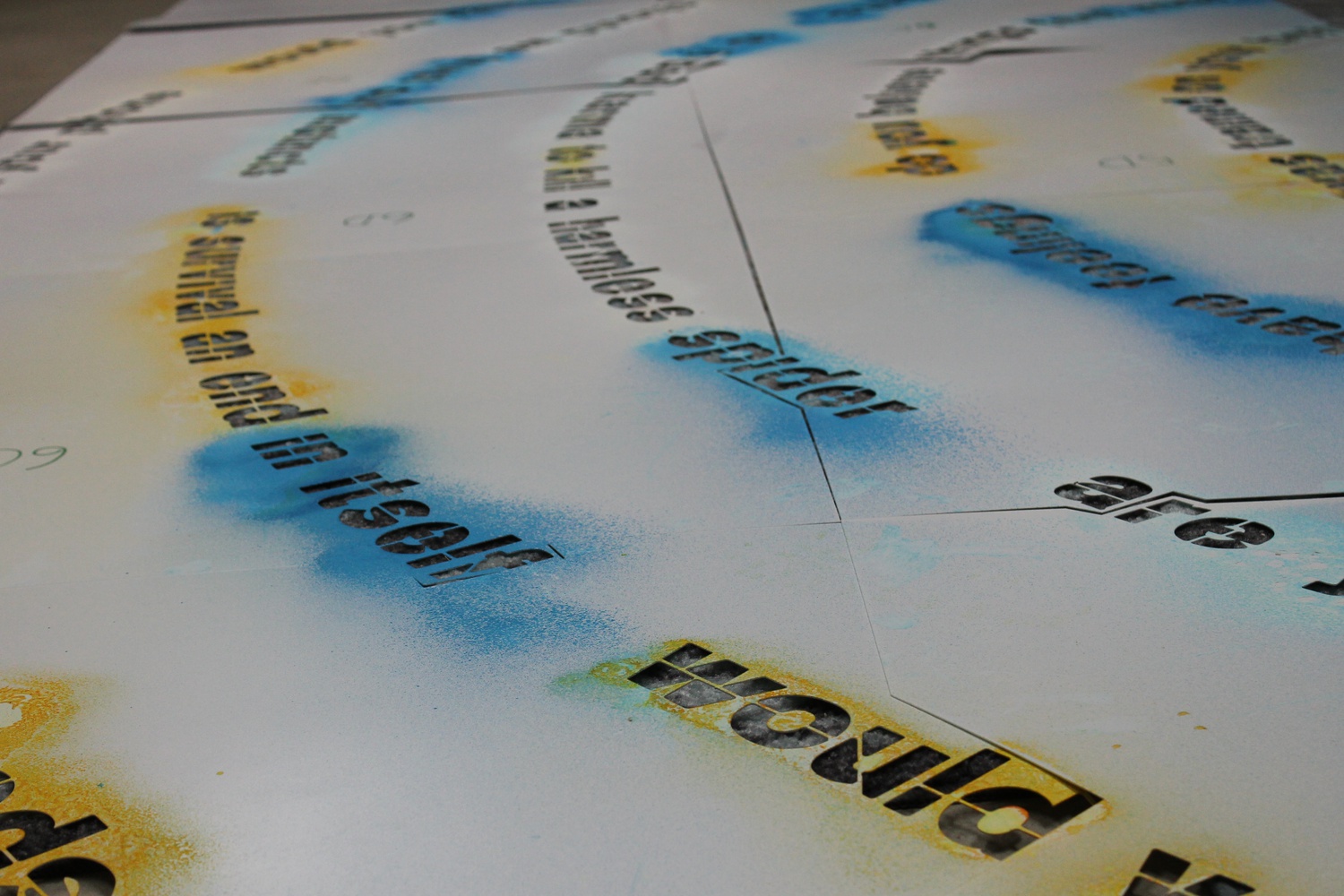Sarah Newman has worked on multiple versions of the Moral Labyrinth, using varied mediums including blue and yellow spray chalk, sticky vinyl, and baking powder.