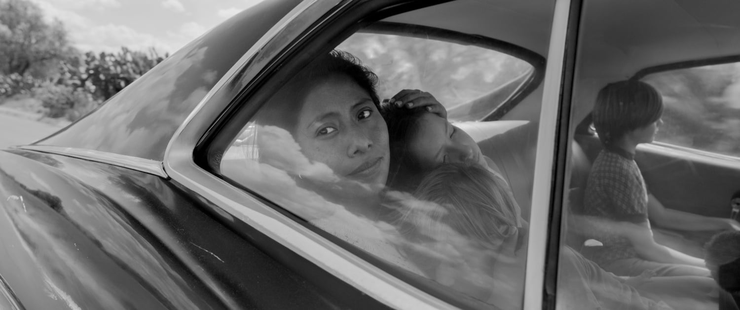 Yalitza Aparicio (left) stars as Cleo in “Roma” (2018) by Alfonso Cuarón.