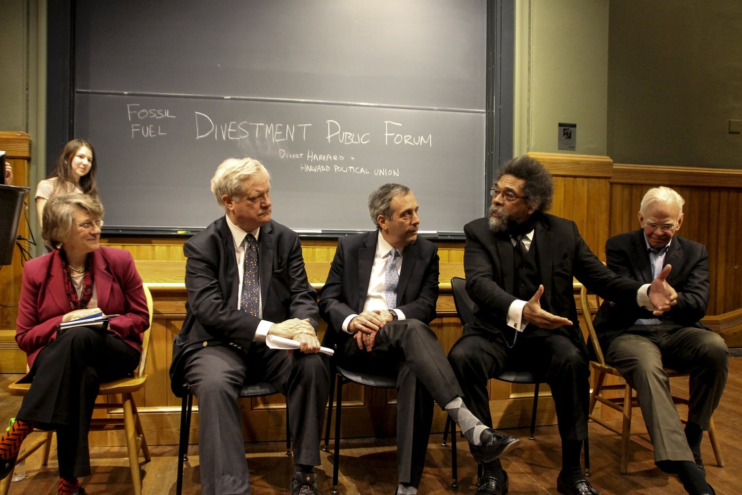 Karen Shapiro, a financial advisor at Progressive Asset Management; James "Jim" T. Engell '73, an English professor; University President Lawrence S. Bacow; Cornel R. West '74, a philosophy professor; and James G. Anderson a chemistry professor speak at a public forum on fossil fuel divestment on Thursday evening in Sever Hall.