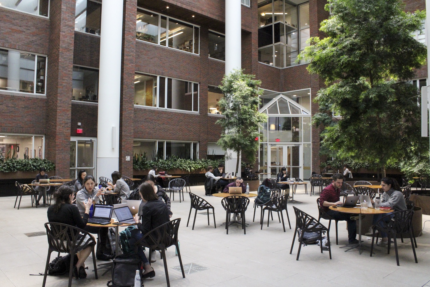 Students work inside the renovated Littauer Building of the Harvard Kennedy School.