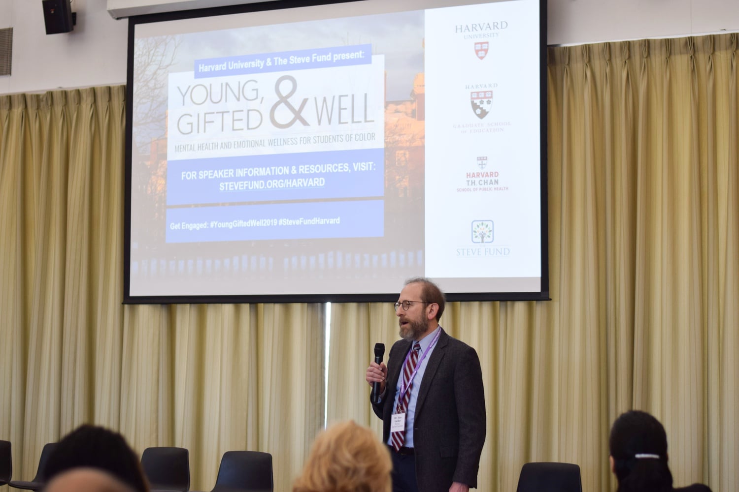 Harvard University Provost Alan M. Garber '76 delivers the welcome speech at Young, Gifted & Well — a day-long conference at the Student Organization Center at Hilles held to discuss mental health and emotional wellness for students of color at Harvard.