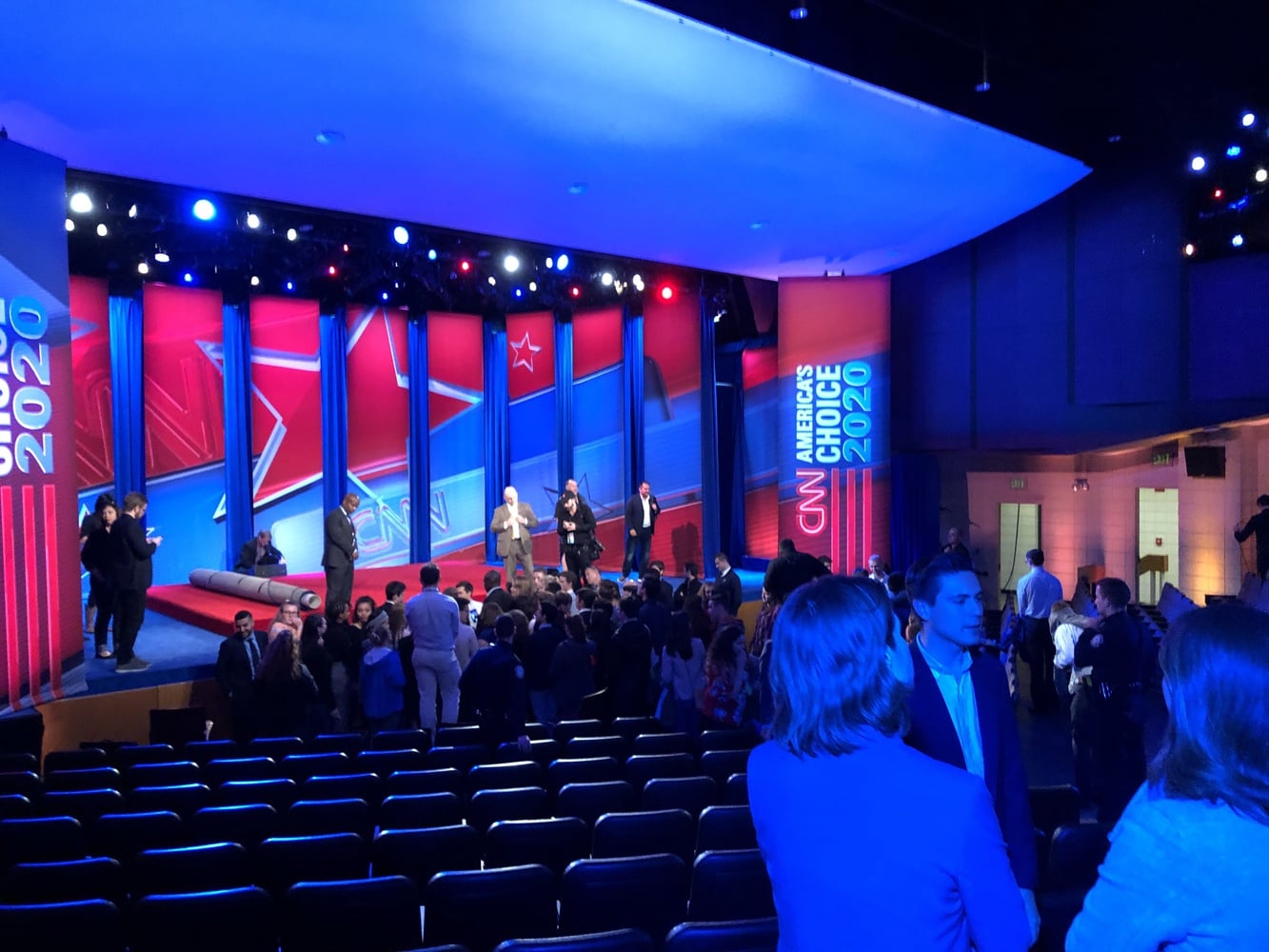 Students and press mingle with Democratic primary candidates at a CNN and Harvard-hosted town hall in Manchester, N.H. Monday evening.