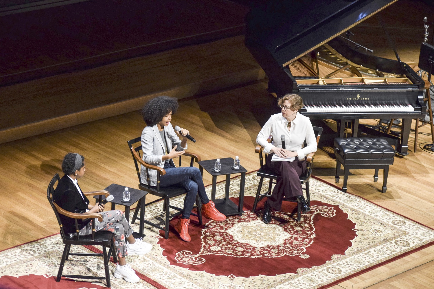 Naomi Wadler, Yara S. Shahidi '22, and Professor Robin Bernstein discuss the experiences of black children in the U.S. during a panel titled "Race, Childhood, and Inequality in the Political Realm" at a "Vision and Justice" event Friday.