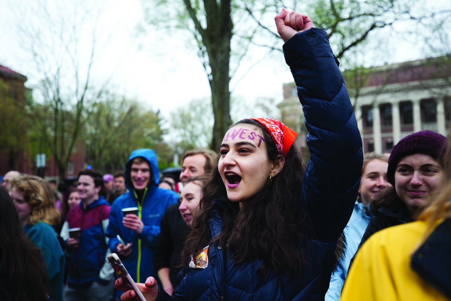 17 year-old climate activist Jamie Margolin shouts at the Flood Harvard rally Friday. Margolin attended the rally while on spring break.