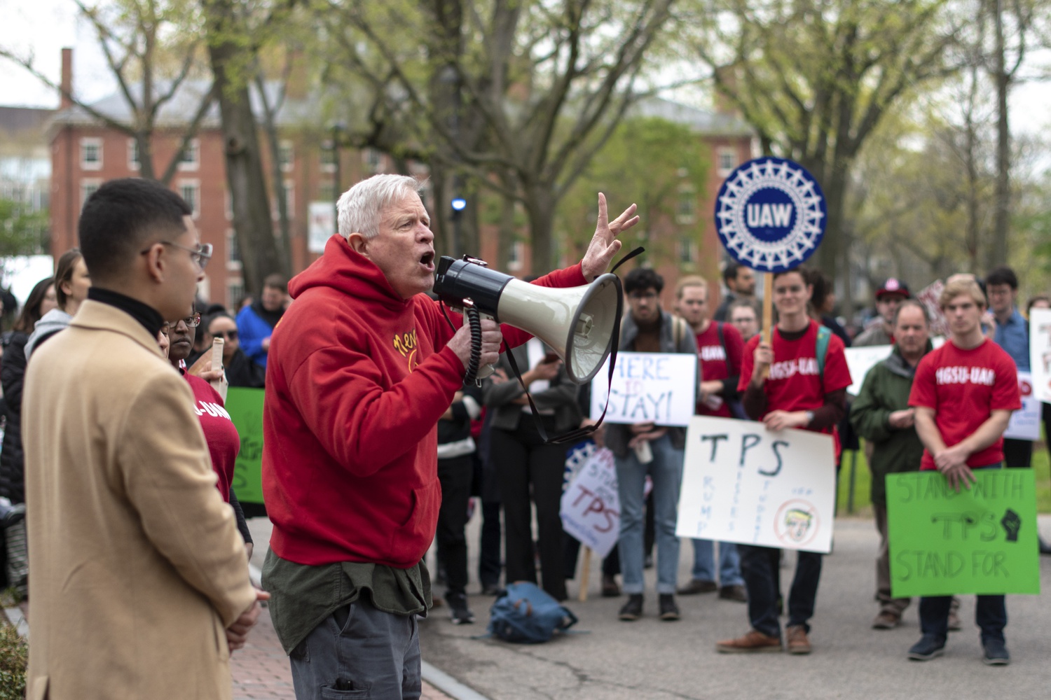 Harvard students supported protestors at the TPS Rally outside of Massachusetts Hall with signs demanding Harvard to take action.