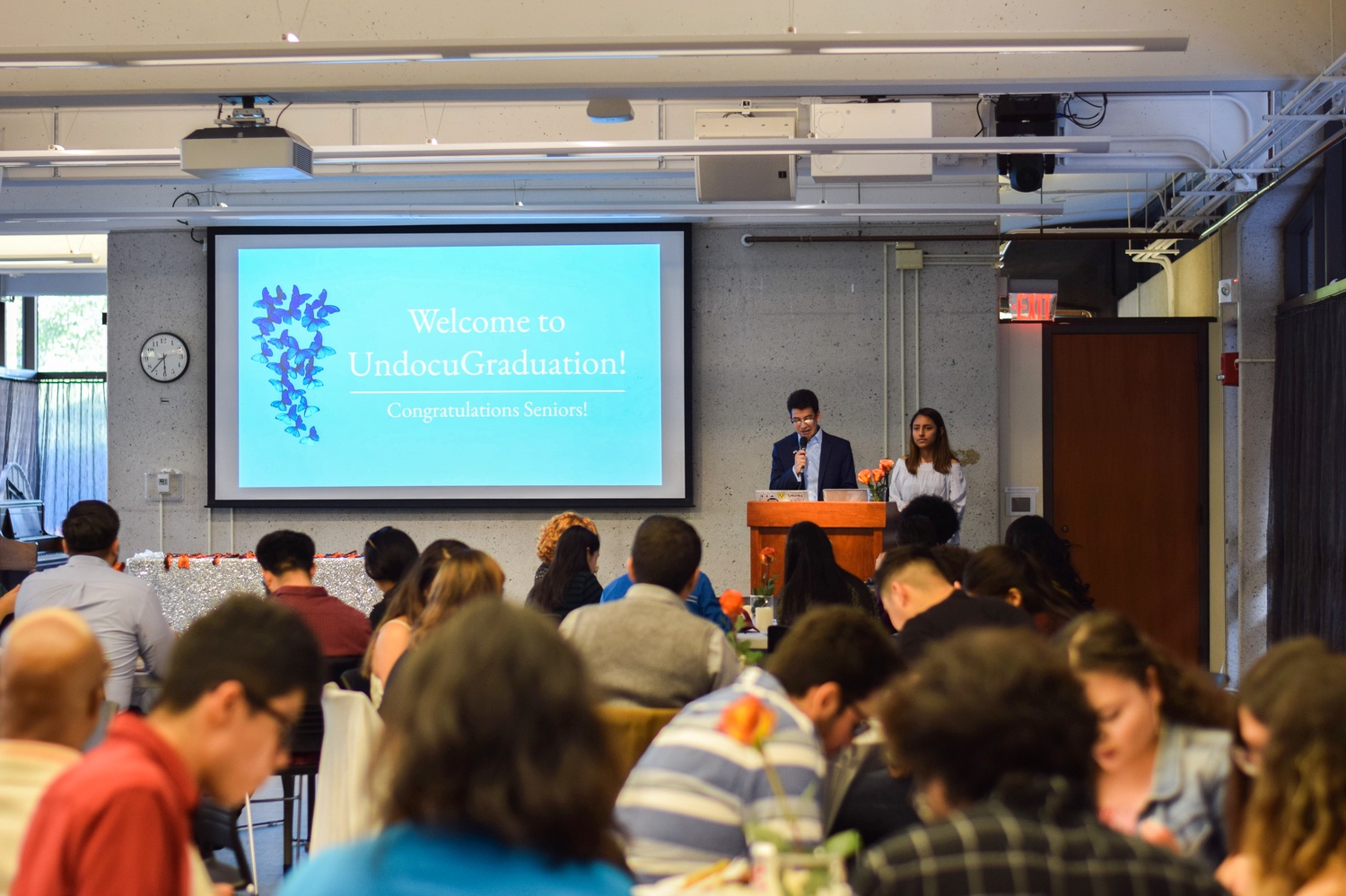 Act on a Dream co-directors Diego Navarrete '21 and Emily A. Romero '21 welcome attendees to the first-ever undocumented students graduation Wednesday evening.