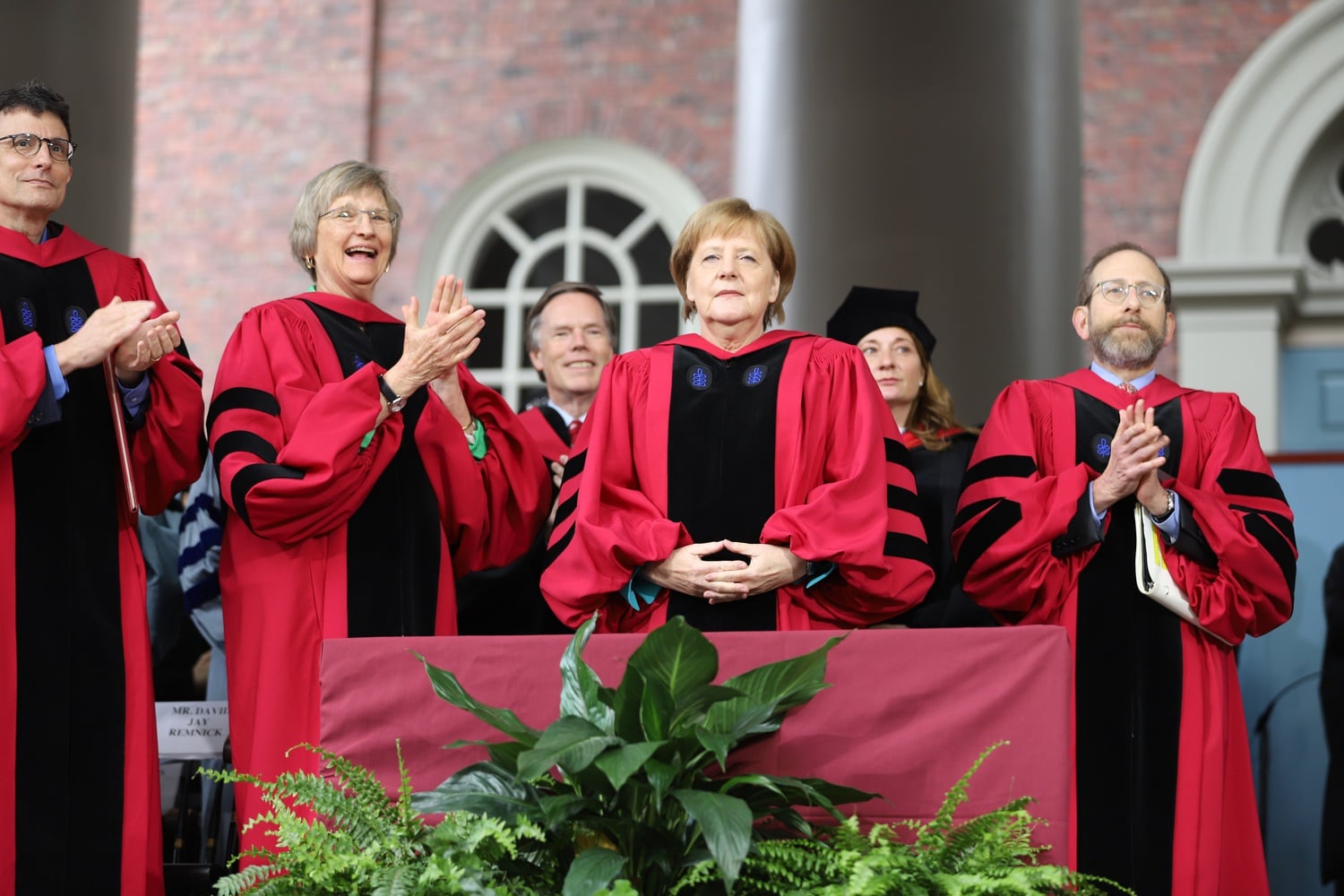 The crowd gives a standing ovation to German Chancellor Angela Merkel as she is introduced as the recipient of an honorary degree.
