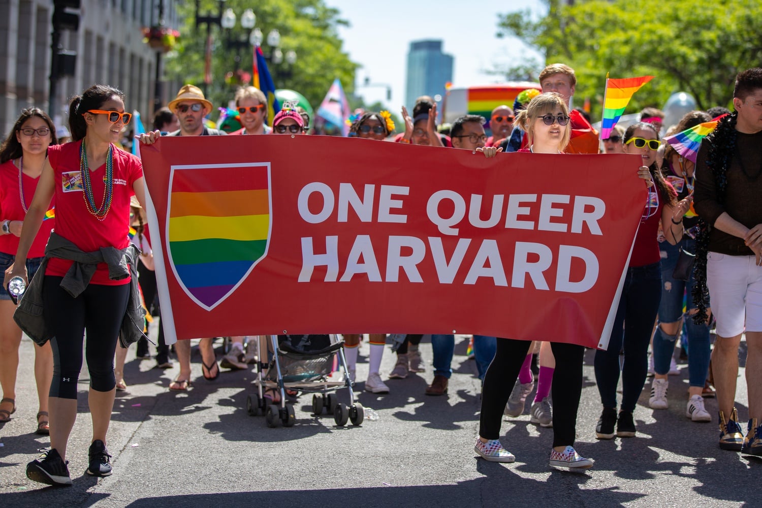 A group of Harvard students marched down Boylston Street as a part of the Boston Pride Parade last Saturday afternoon. This year's theme was "Looking Back, Loving Forward" in celebration of the 50th anniversary of the Stonewall Riots.