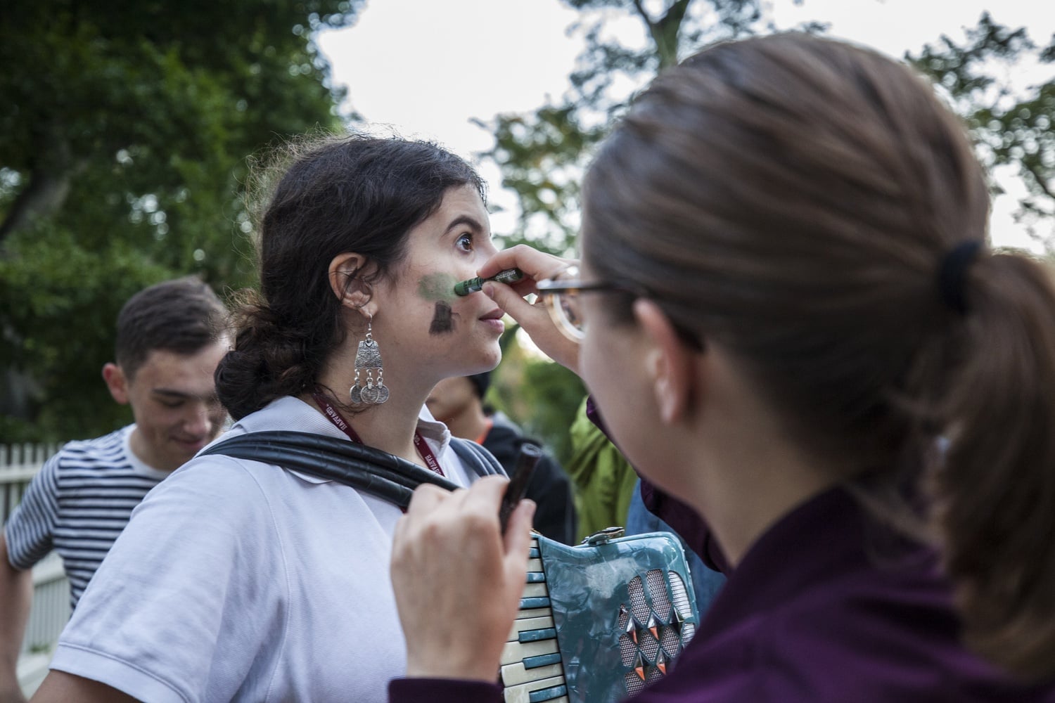 Divest Harvard protesters gather outside University President Lawrence S. Bacow's home Thursday morning to stage a rally.