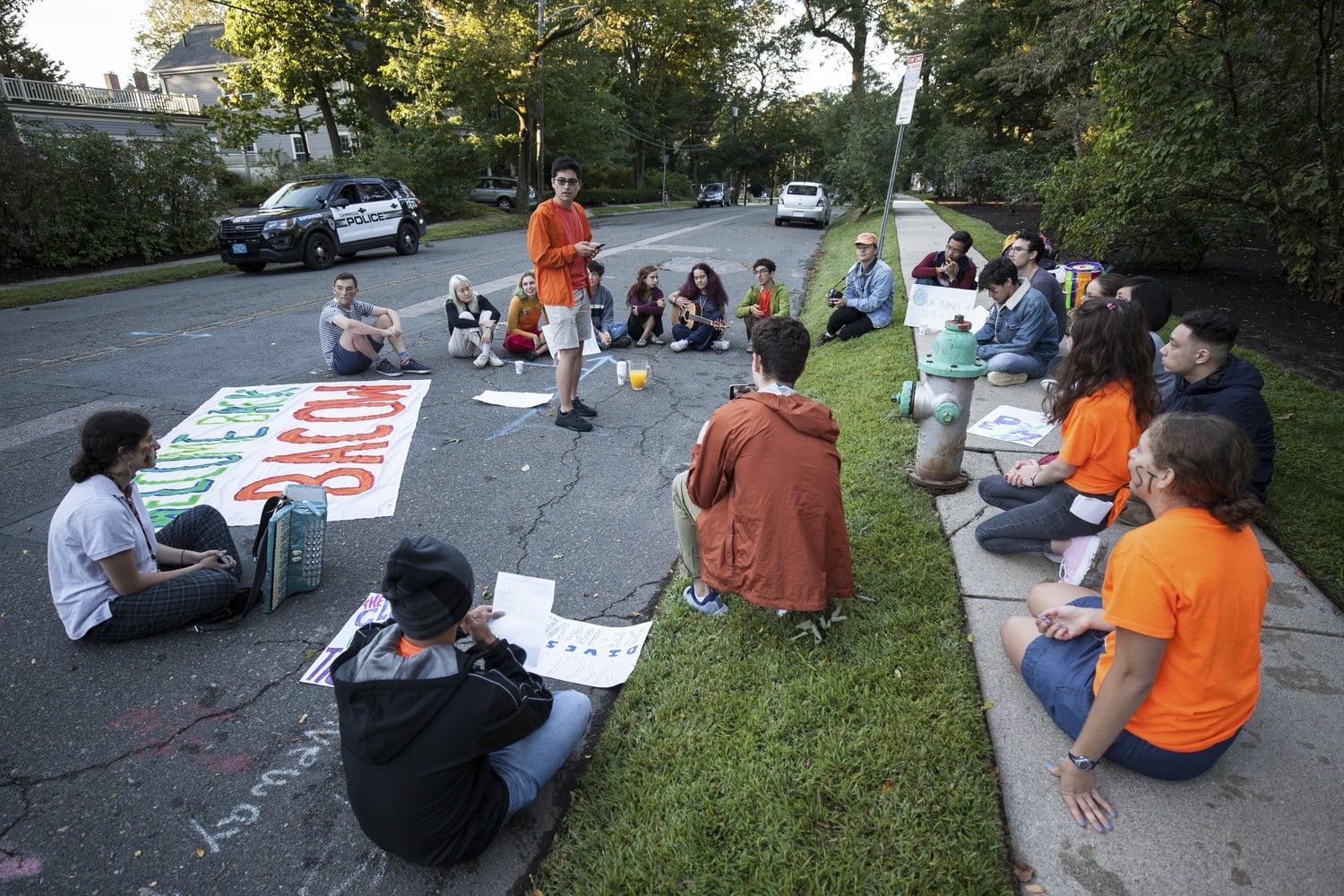 Kaia B. Berman-Peters '23 gets face paint before a Divest Harvard protest Thursday morning.