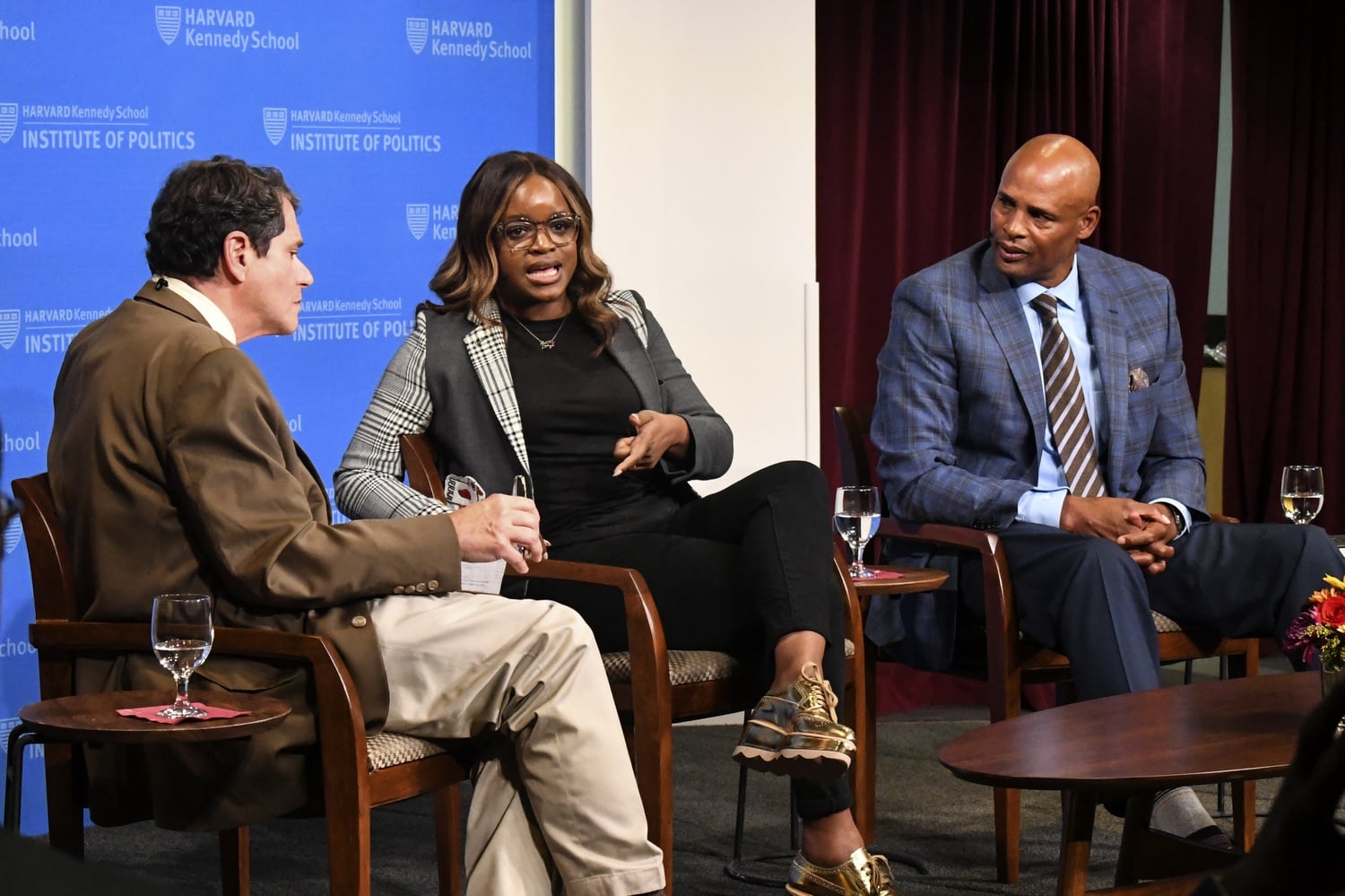 Former IOP fellow Brittany Packett, and former NBA player Clark Kellogg discuss the power of sports and the positive influence athletes can have on their community at an Institute of Politics event Tuesday night.