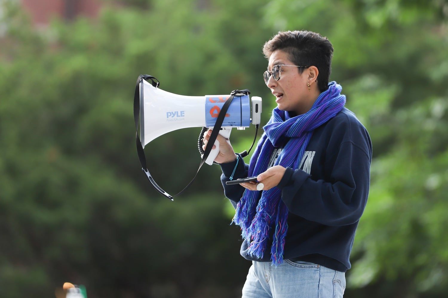 Ph.D. student Xitlalli Alvarez spoke in favor of divesting from private prisons at the rally Thursday.