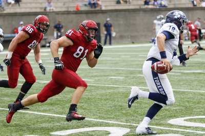 Cover image for San Diego Staves Off Late Harvard Push as Football Drops Opener, 31-23
