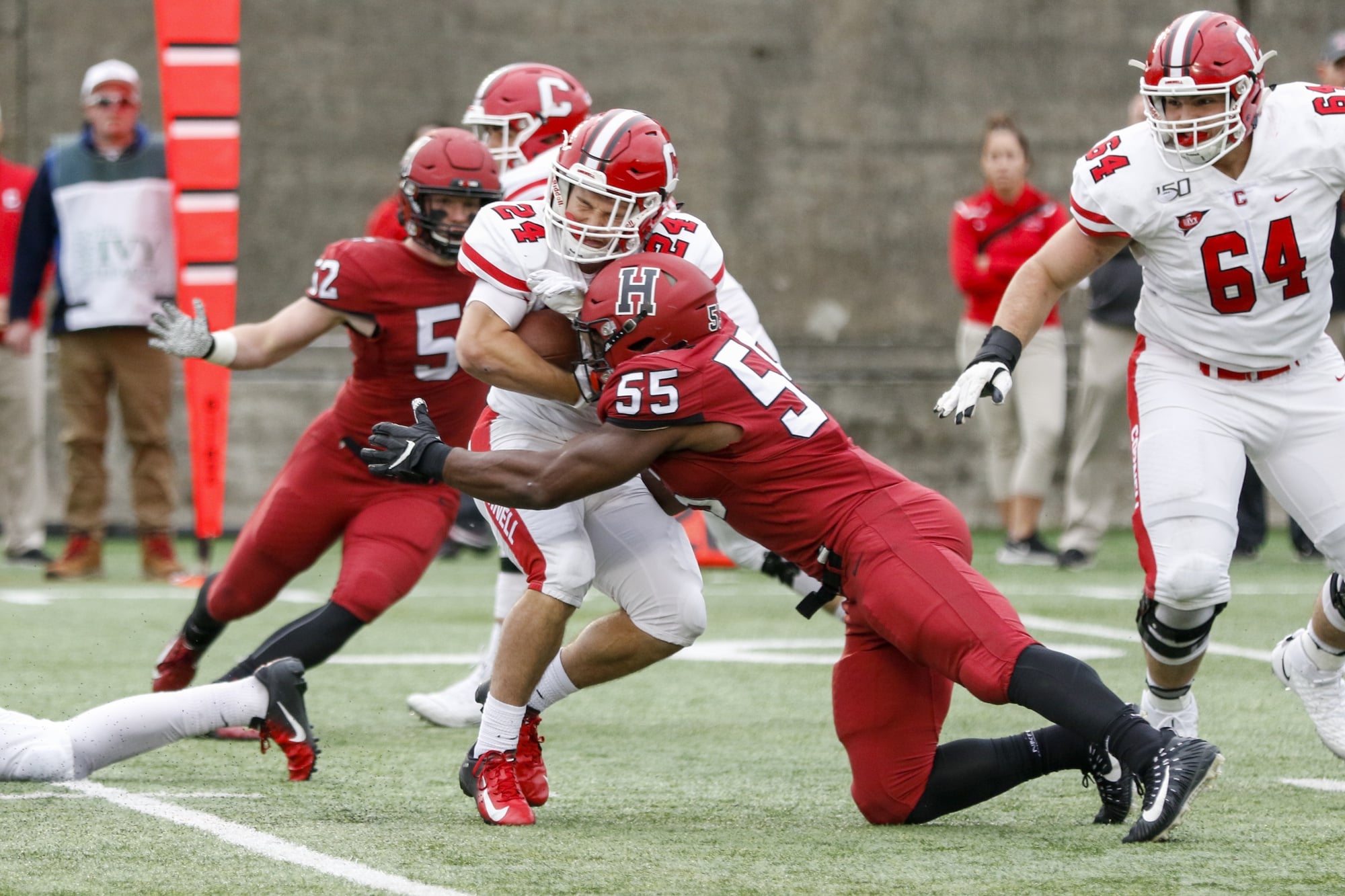 Junior linebacker Jordan Hill stops cold a Cornell running back. The Harvard defense held the Big Red to under one yard per carry.