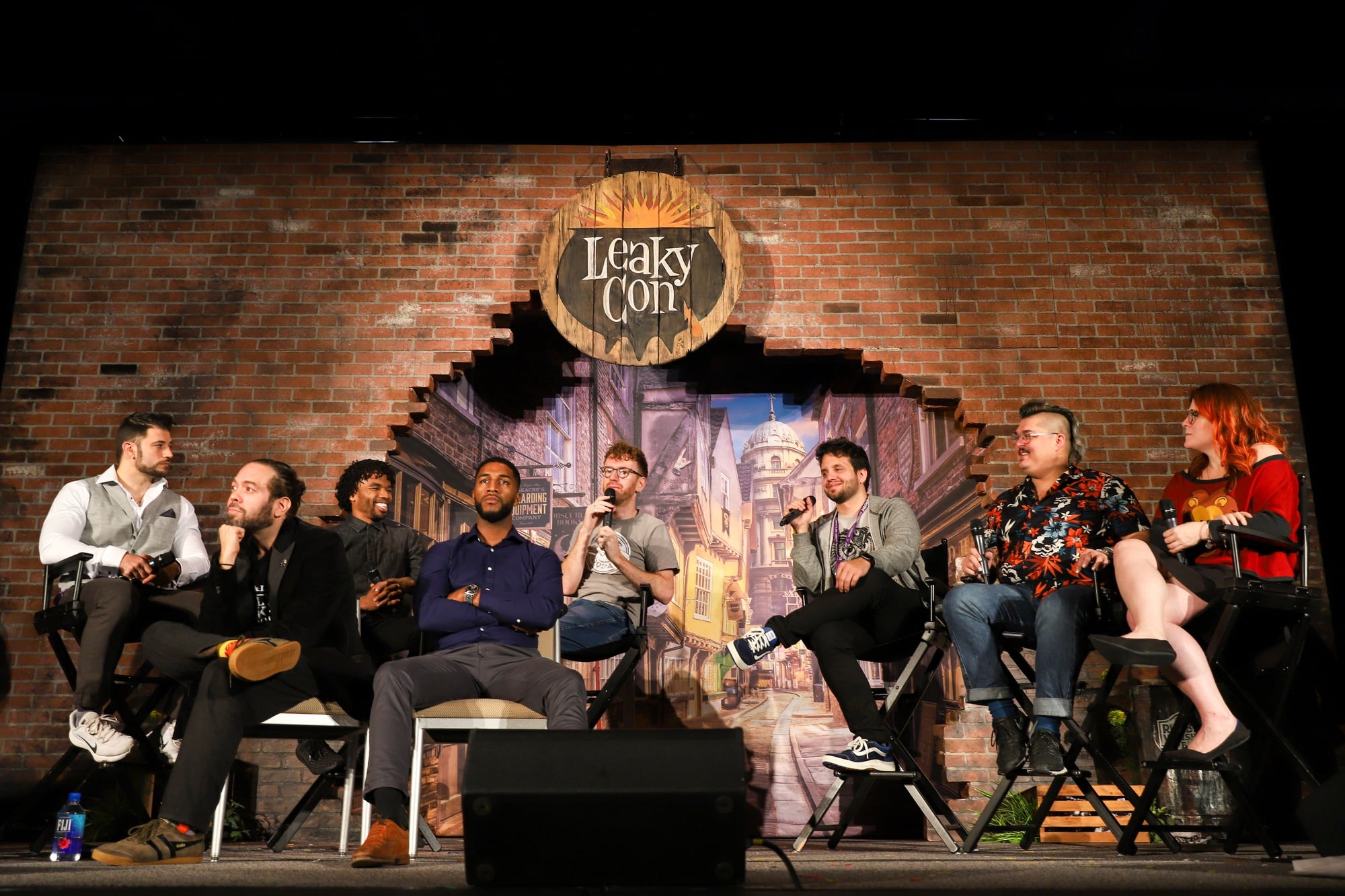 Stanislav Yanevski ("Victor Krum"), Dan Fogler ("Jacob Kowalski"), Luke Youngblood ("Lee Jordan"), Louis Cordite ("Blaise Zabini"), and Chris Rankin ("Percy Weasley") sit on a panel reminiscing fondly about behind the scenes shenangians of the Harry Potter film series.