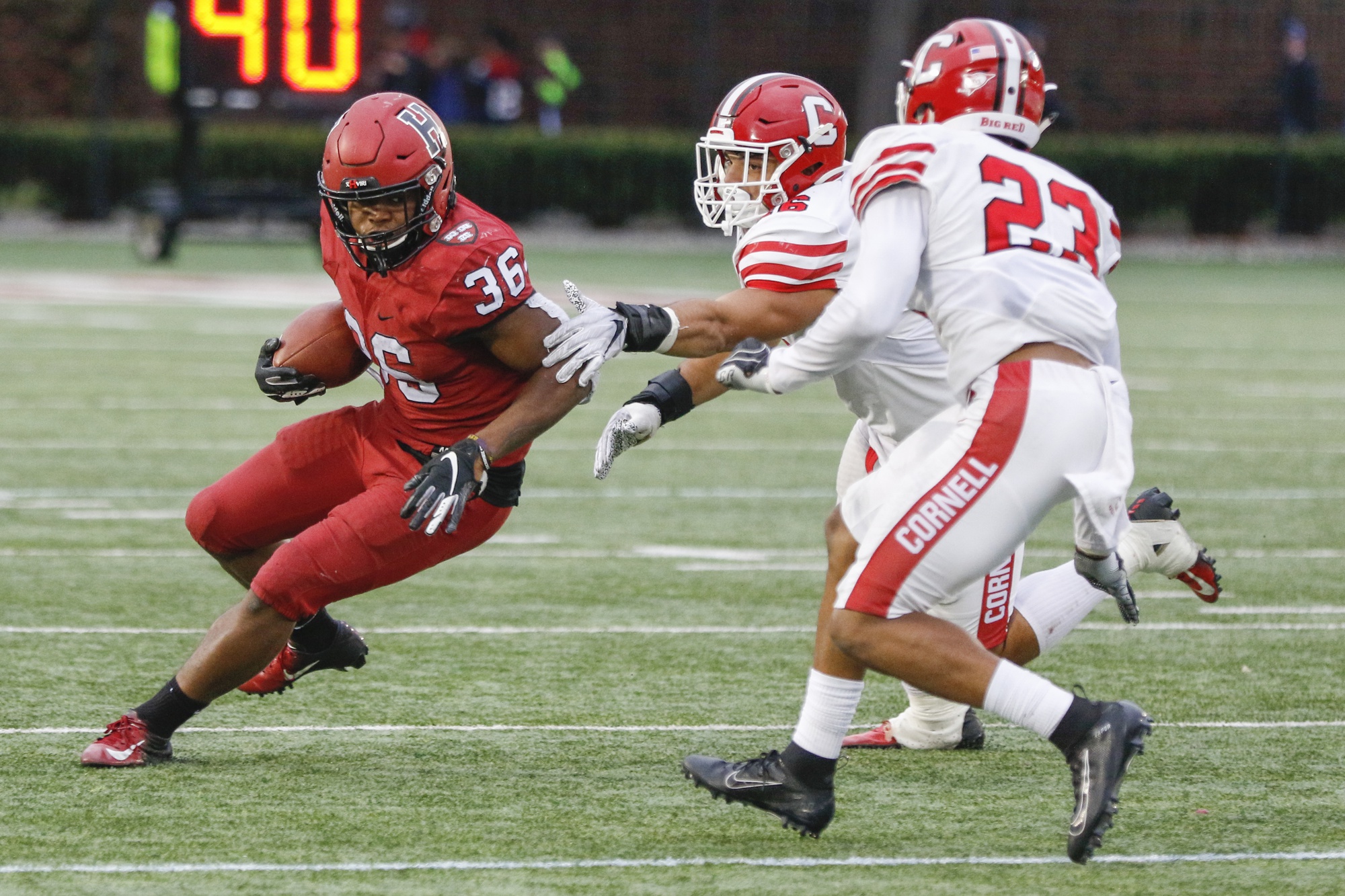 Junior running back Devin Darrington speeds past Cornell defenders. He ended the game with 94 rushing yards and a touchdown.