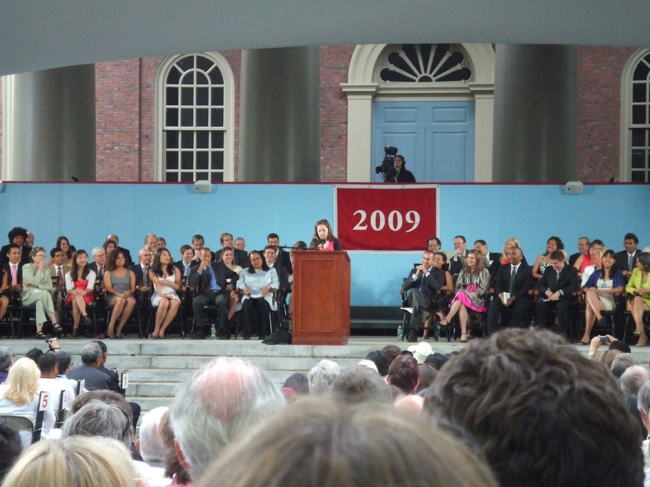 Seniors watch a student speaker during the Commencement Day exercises in June 2009.