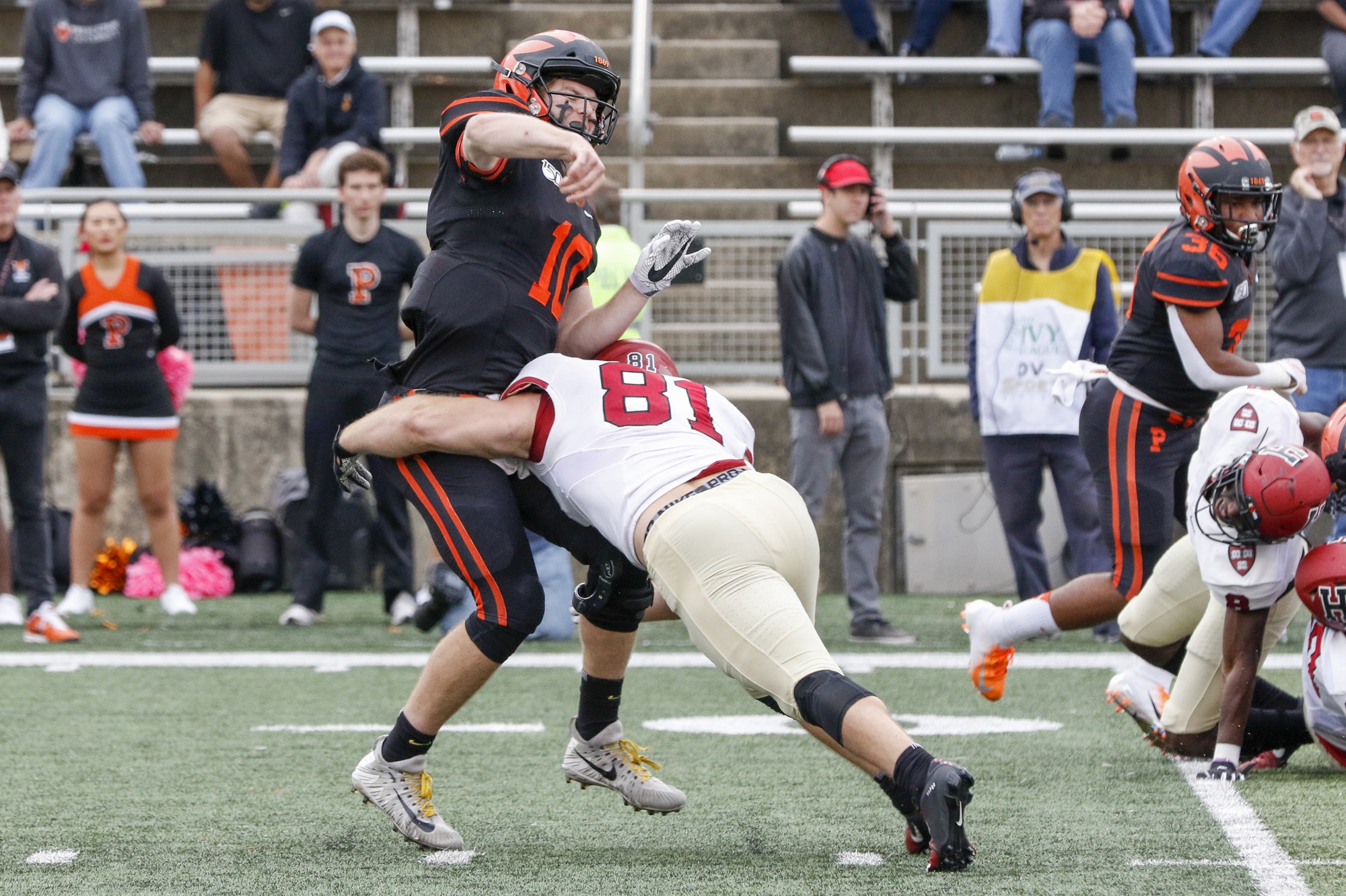 Quarterback Kevin Davidson gets a pass off just before being sacked by Crimson senior defensive lineman Brogan McPartland.
