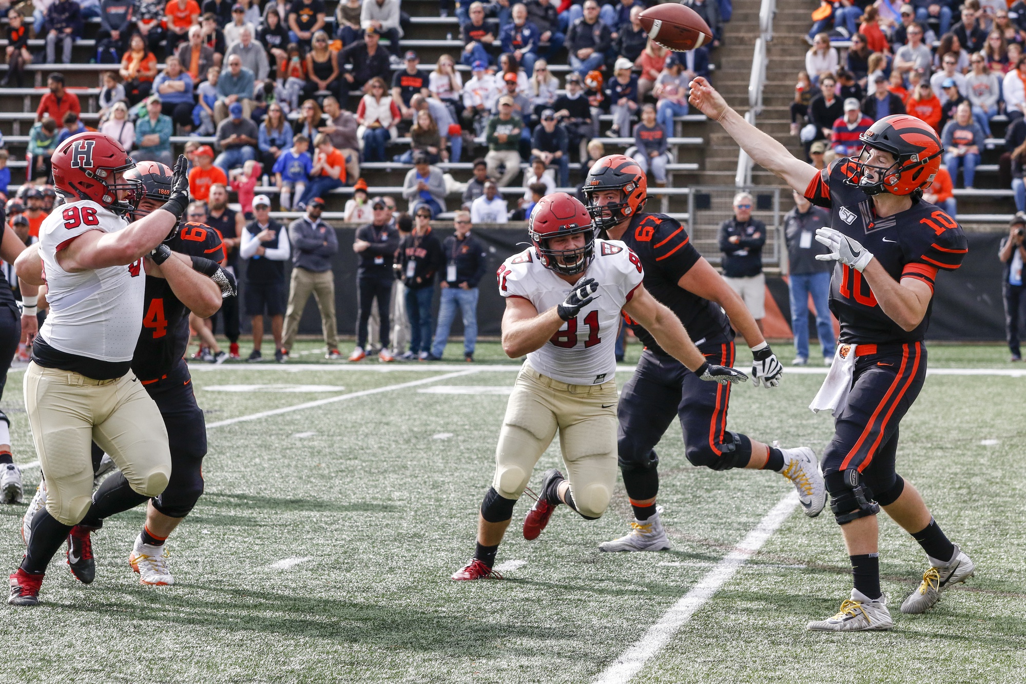 Harvard tight end Haven Montefalco just misses sacking Princeton quarterback Kevin Davidson, who went on to complete three touchdowns in the Tigers' victory.