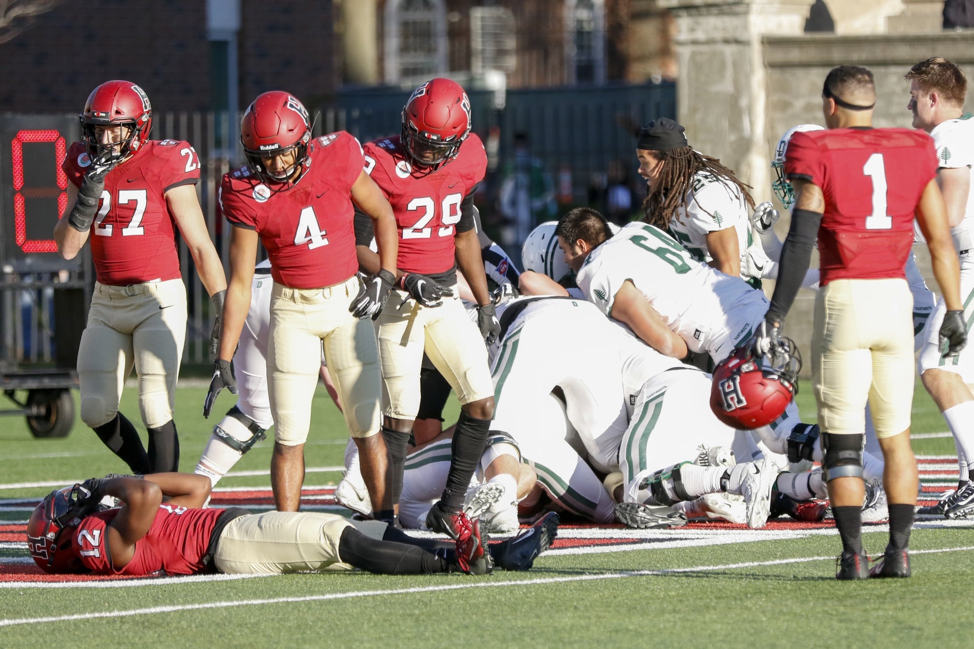 Junior defensive back Isaiah Wingfield lays on the ground after Dartmouth's, final second, Hail Mary attempt is successful. The loss ends Harvard's chances at an Ivy League title.