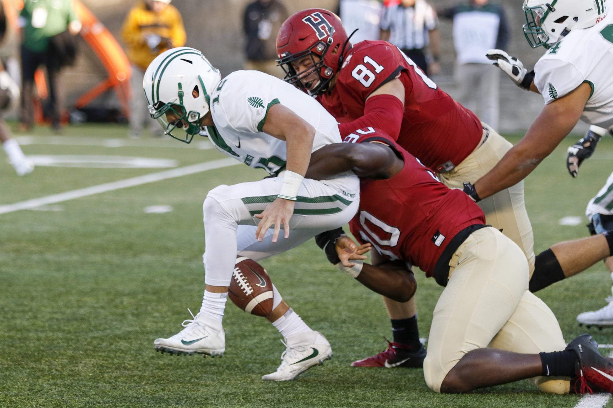 Sophomore defensive lineman Truman Jones strips Dartmouth quarterback Derek Kyler. The change of possession returned the ball to Harvard with the lead and 1:19 to burn.