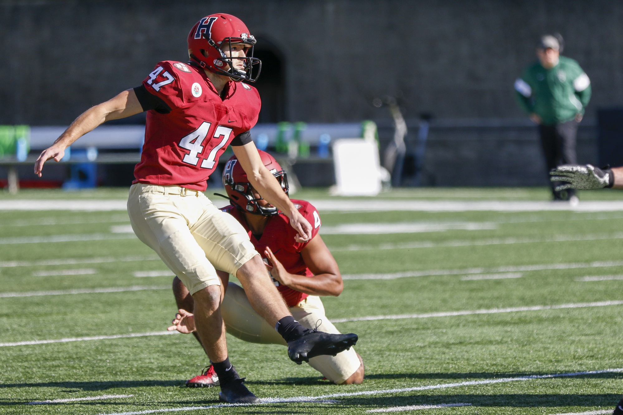 Senior kicker Jake McIntyre eyes his true, 41-yard kick early in the contest. McIntyre was the only player on the Crimson that logged points on the afternoon.
