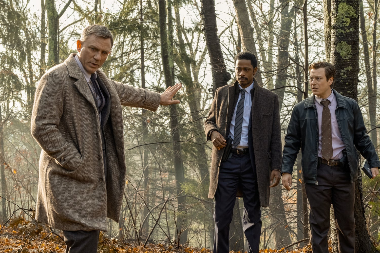 Daniel Craig (left) stars as Benoit Blanc, LaKeith Stanfield (center) stars as Lt. Elliott, and Noah Segan (right) stars as Trooper Wagner in “Knives Out” (2019), directed by Rian Johnson.