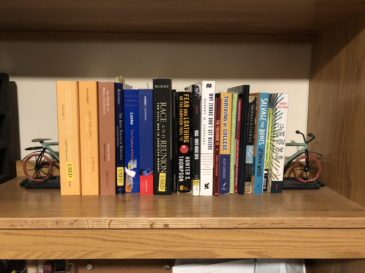 A student's shelf containing the Social Studies 10 booklist.