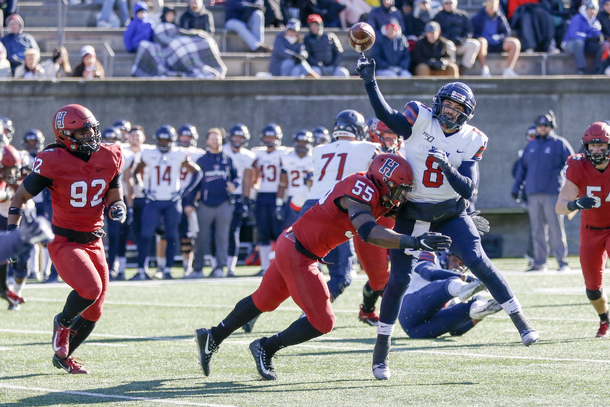Junior linebacker Jordan Hill hits Penn quarterback Nick Robinson as he throws. The visiting play caller was bullied all afternoon, thrown to the ground as he threw on several occasions.
