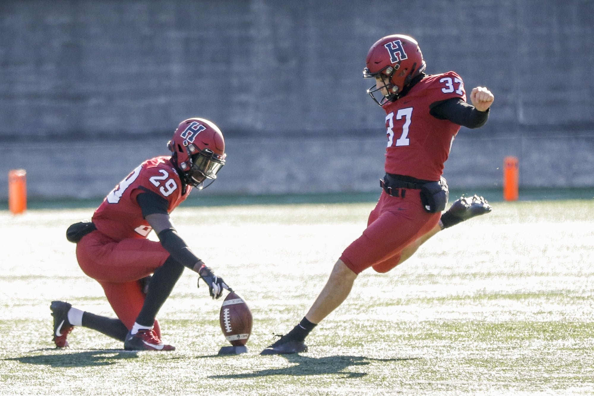 Sophomore Kicker Jonah Lipel is forced to kick with a holder due to the strong winds funneled through the stadium on the afternoon.