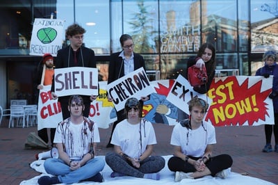 Cover image for Divest Harvard Oil Pouring Pic